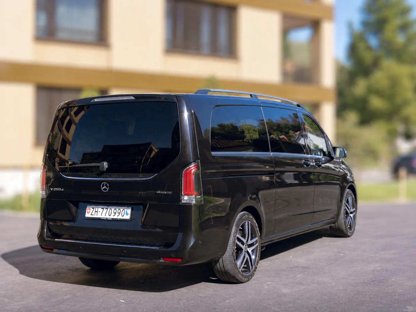 Black Mercedes V-Class van, rear three-quarter view