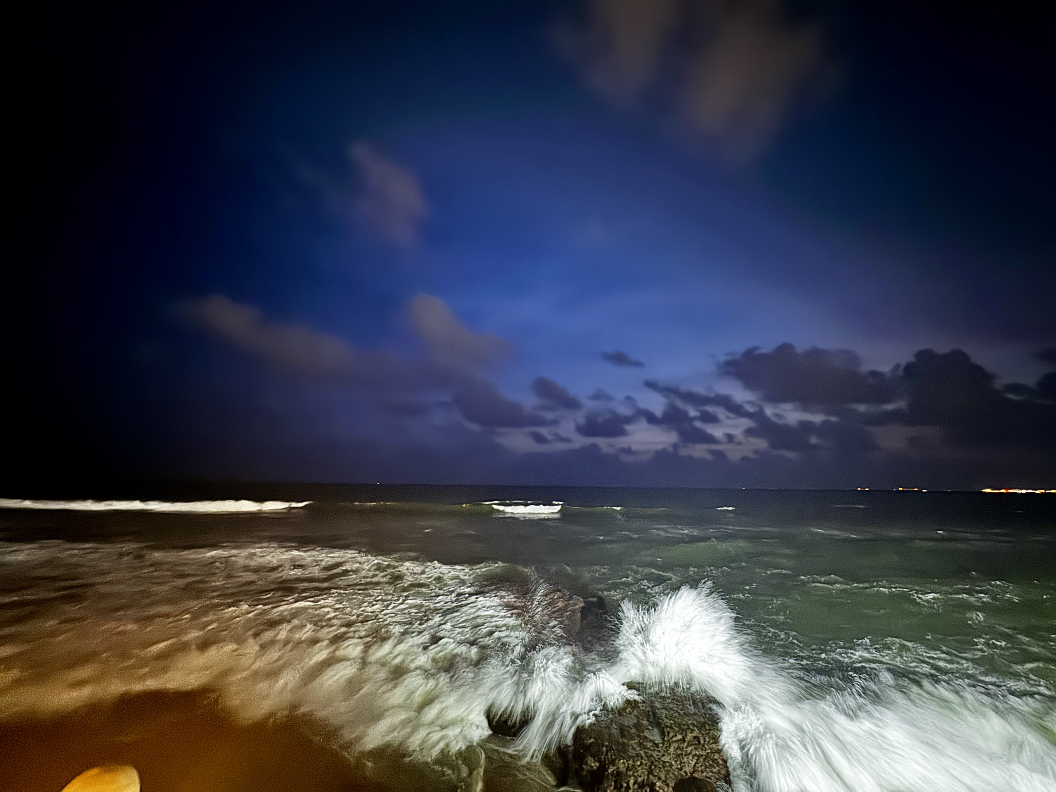 The waves crashing in