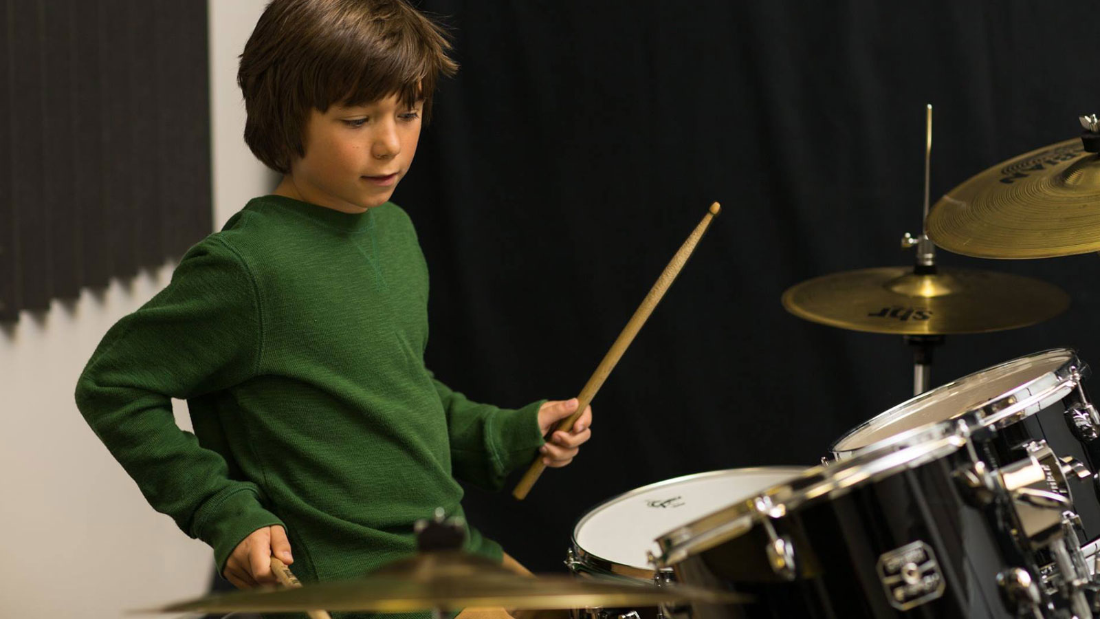 Boy playing drums