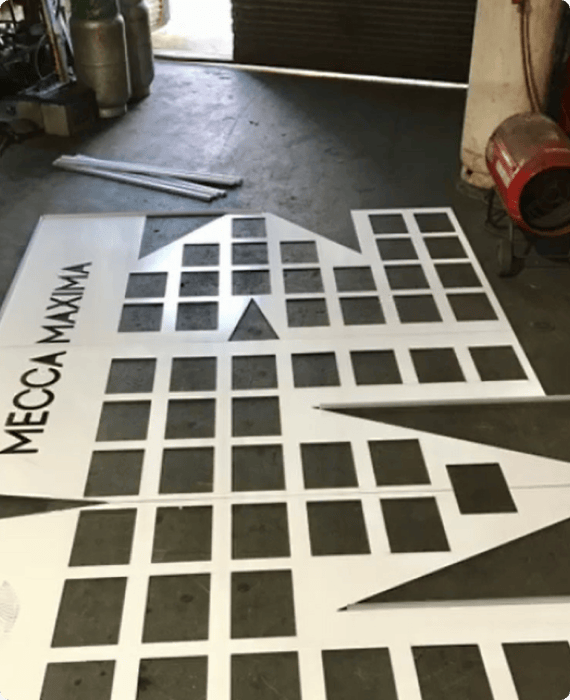 Custom-cut building facade panels in the DSS workshop
