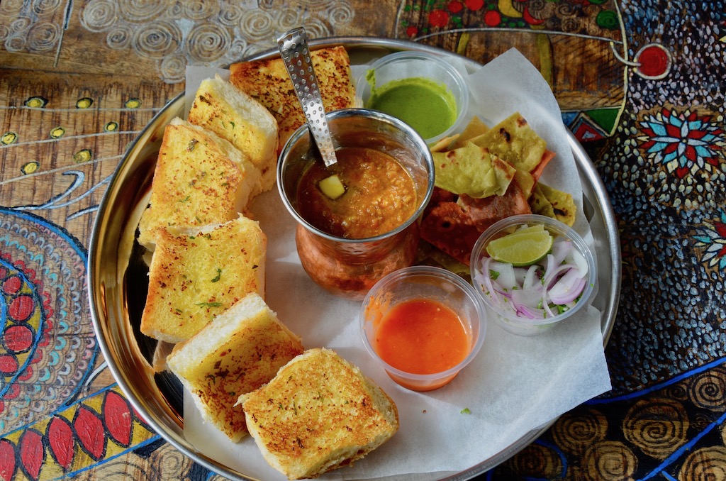 Pav Bhaji AED 20 Fondue of vegetables topped with butter, served