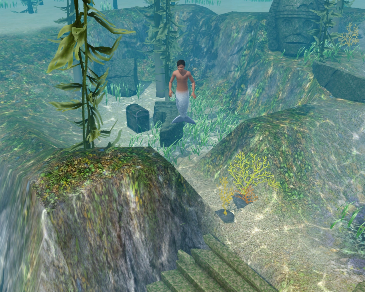 Teen mermaid underwater at dive site