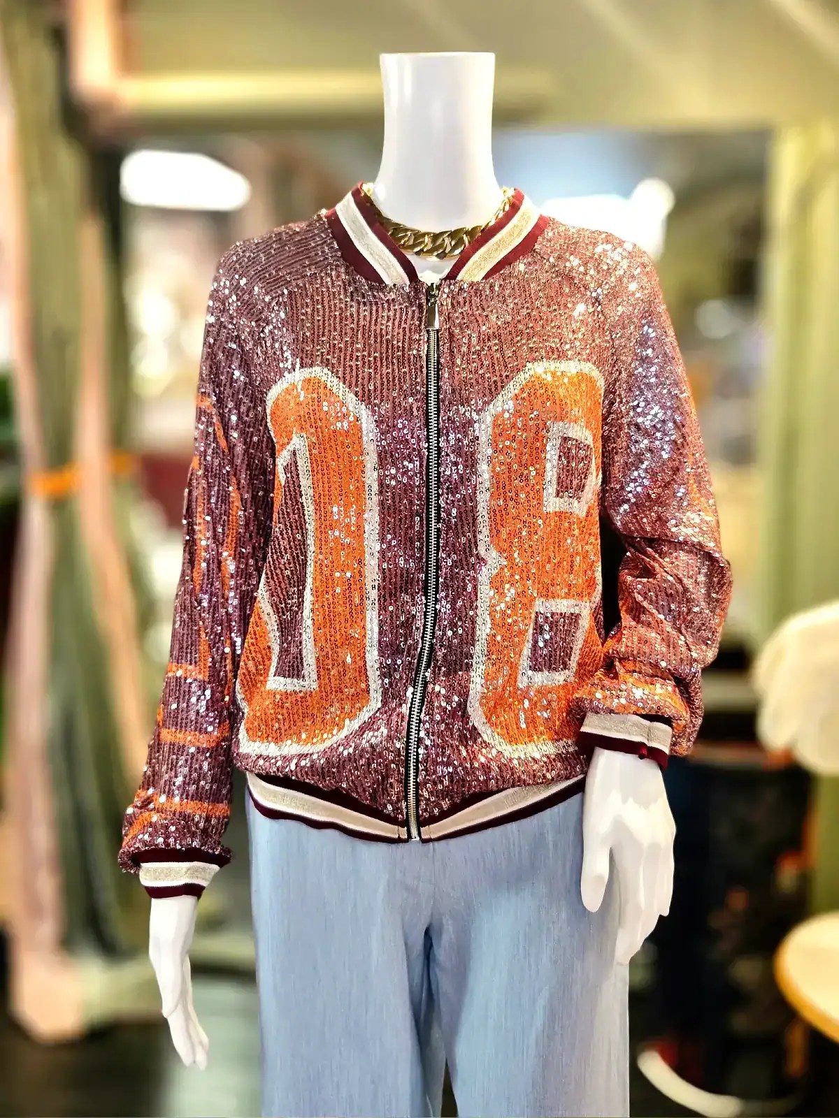 Palliet bomberjakke i Bordeaux og orange med glitrende finish.