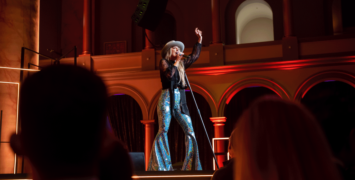 Lainey Wilson performing at the Axios After Dark Presented by Live Nation event.