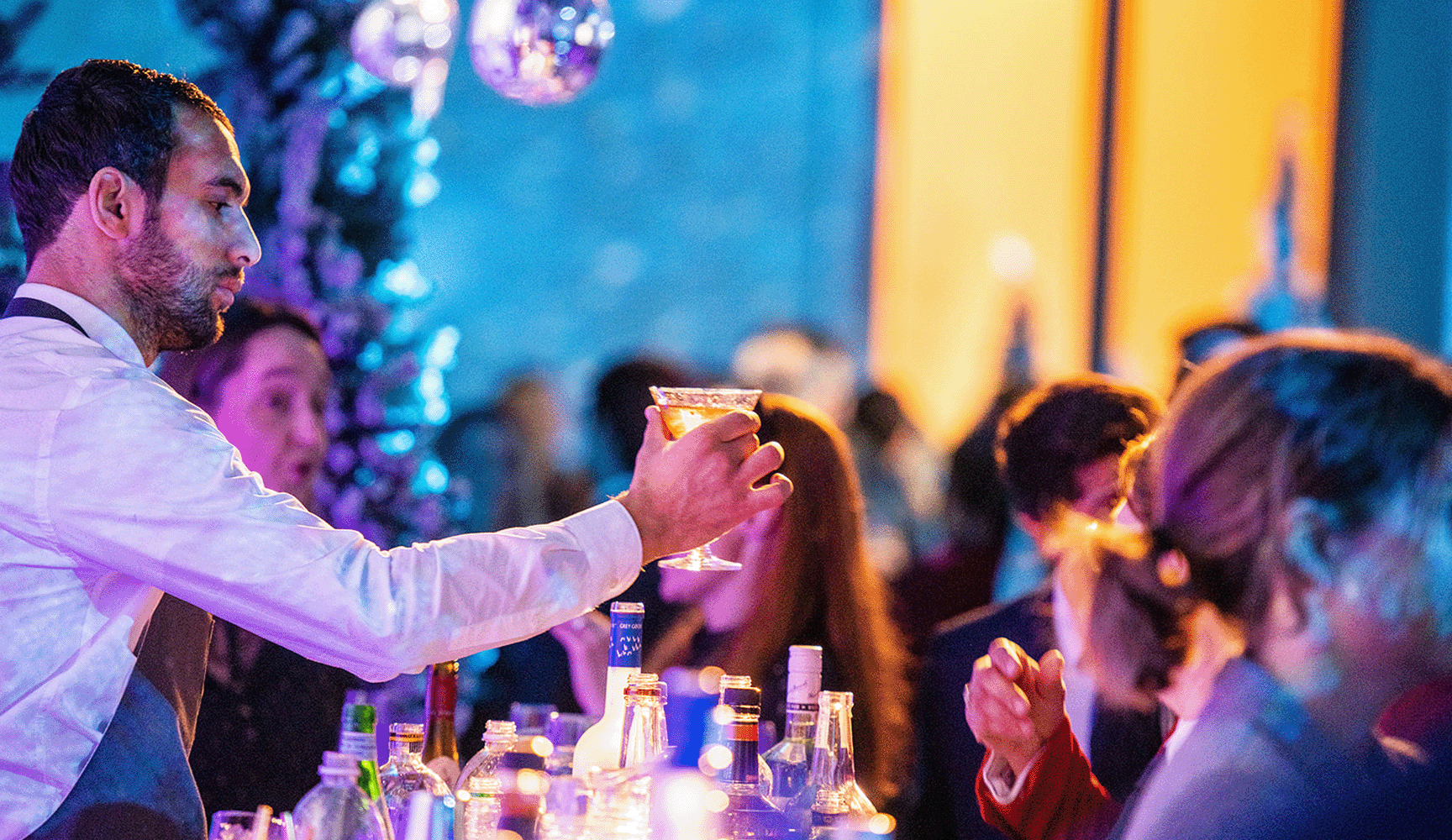 Man serving drinks at the bar
