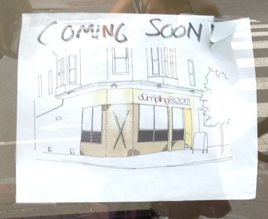 Artist's rendering of Dumpling House posted in the window