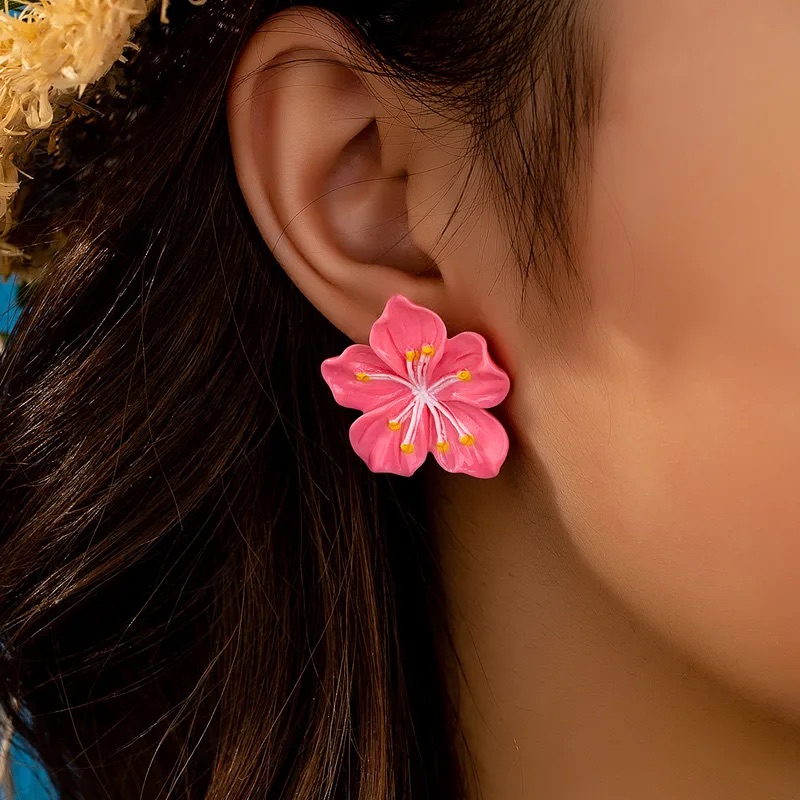 Aretes de flor fucsia retro