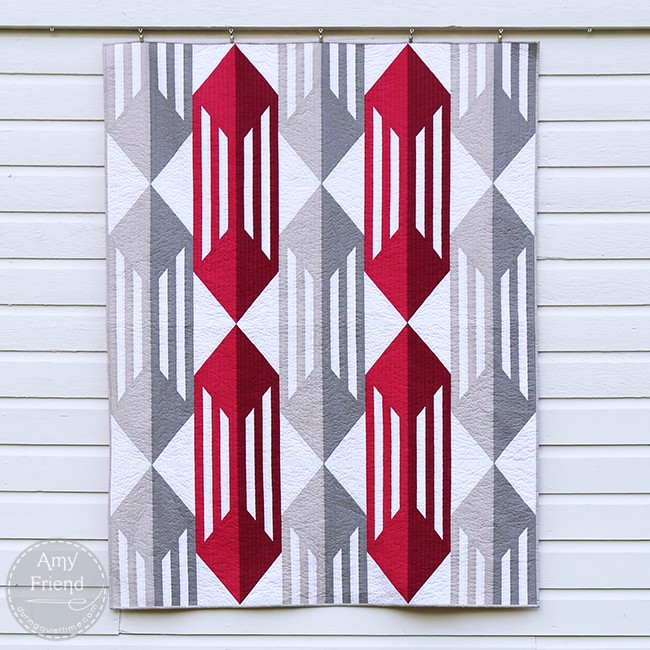 Modern Caged Quilt pattern with red, white, and grey geometric blocks.