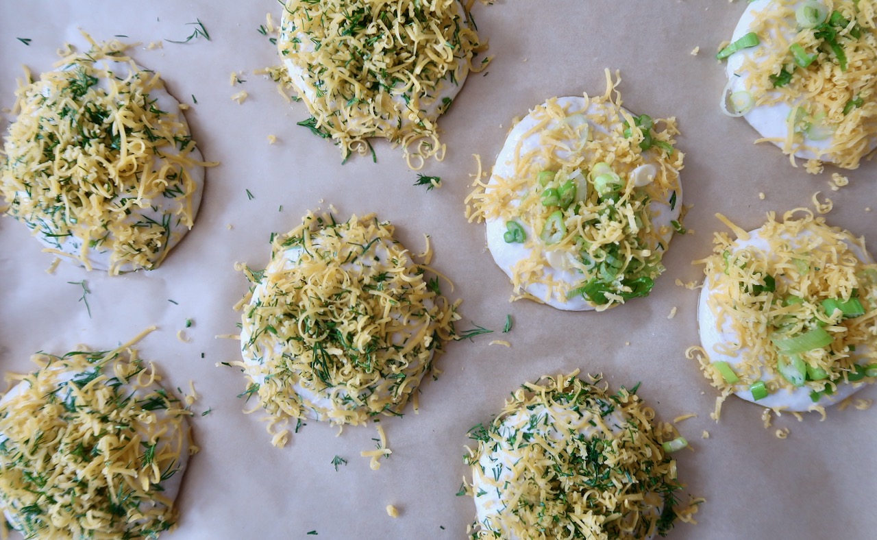 shaped and topped buns ready for baking