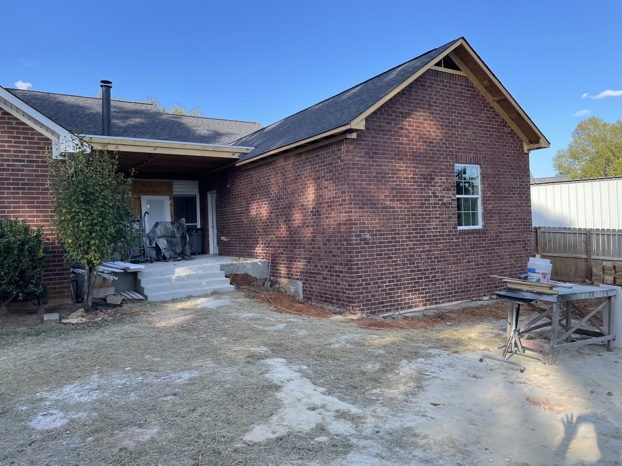 Finished brick home addition matching the original house