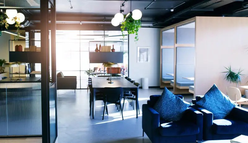 Modern office interior with meeting table and lounge seating