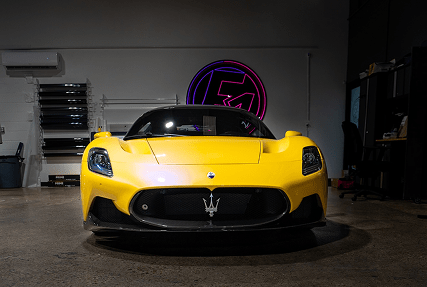 Car undergoing ceramic coating at E1 AutoSpa Houston Heights