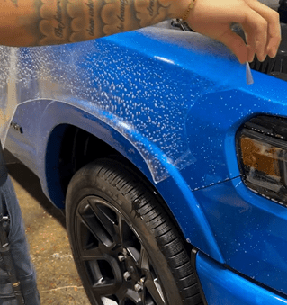 XPEL paint protection film (PPF) on Tesla at E1 AutoSpa Houston