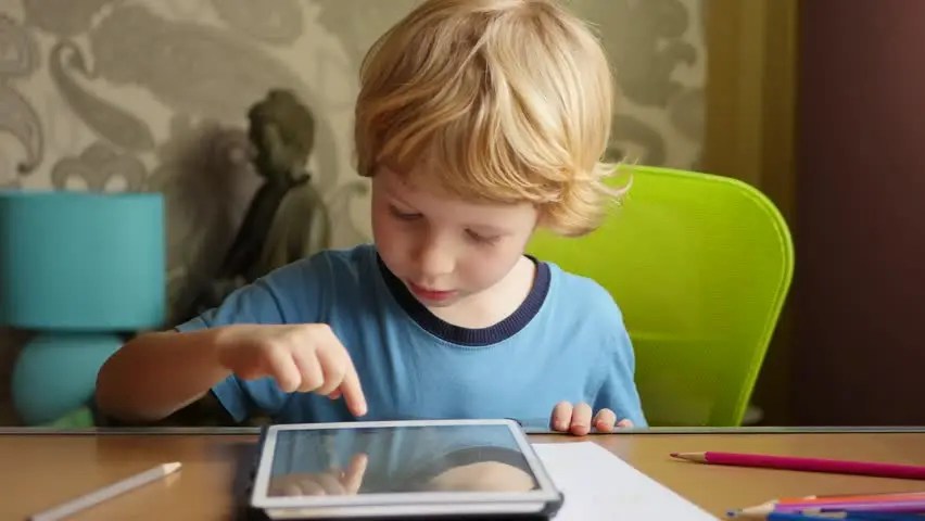 child with ipad