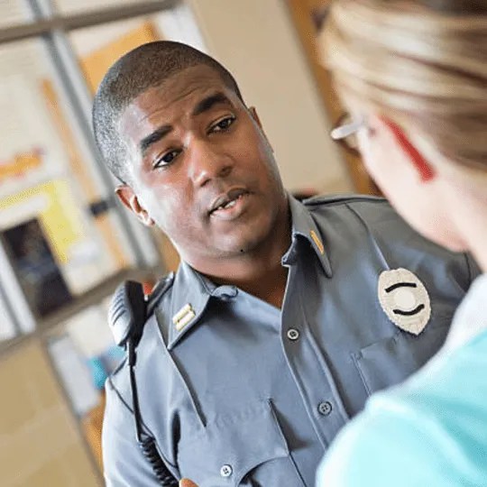 Security officer talking trying to receive feedback.