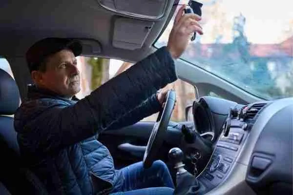 An officer inside of a vehicle performing mobile patrolling.