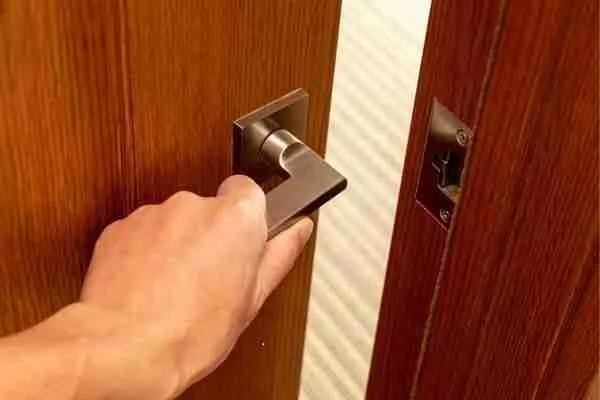 Man about to enter a hotel safe.