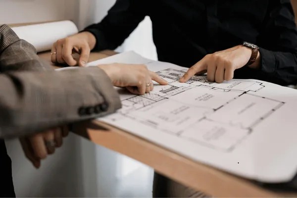 Two business owners going over plans.