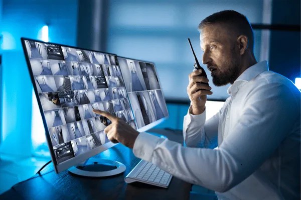A man using touch-screen business security systems.