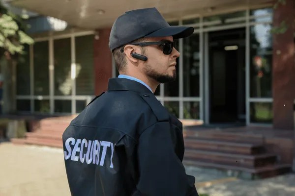 A licensed security officer at his post patrolling.