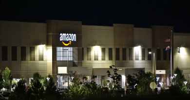 amazon concrete building during nighttime. (How to Make Money with Amazon)