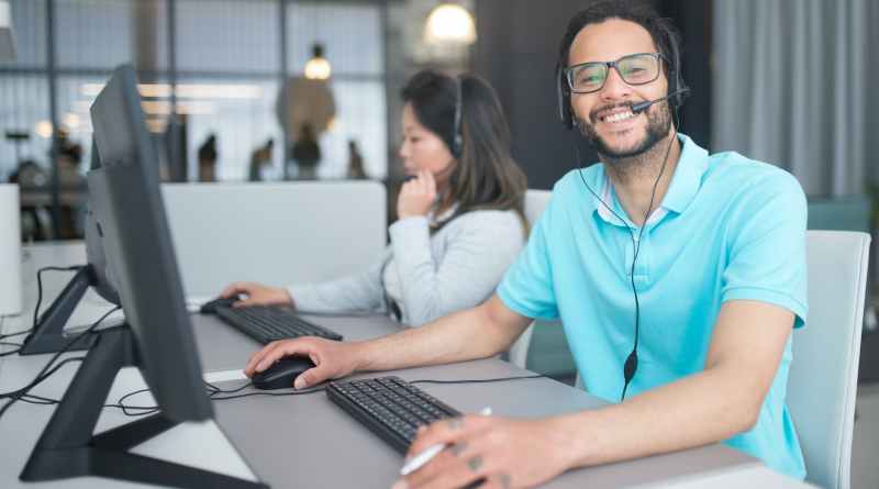 a man and a woman working in a call center