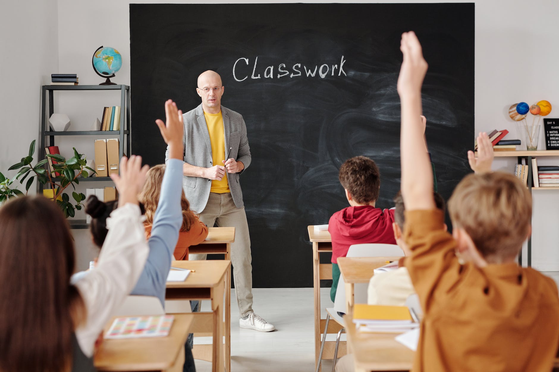 teacher teaching his students