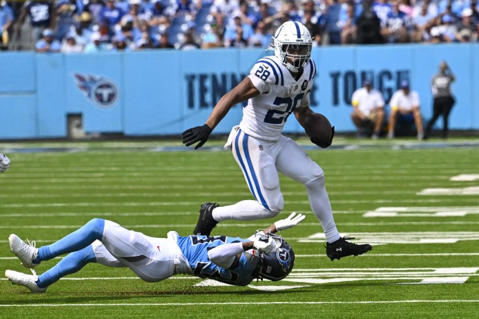 Jonathan Taylor Hat Trick Vs Titans, Week 3 2025 Jonathan Taylor crosses the goal line for the Colts against the Titans