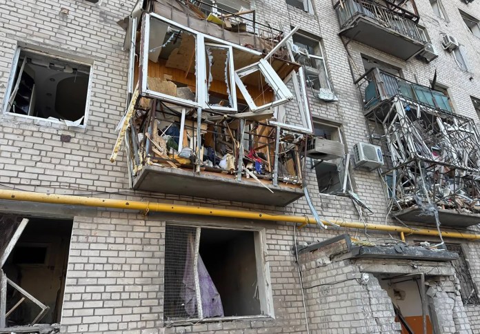 Residents reinforce blown-out windows after the night’s strikes in Kyiv Residents tape plastic over shattered windows aResidents reinforce blown-out windows after the night’s strikes in Kyivfter strikes in Kyiv