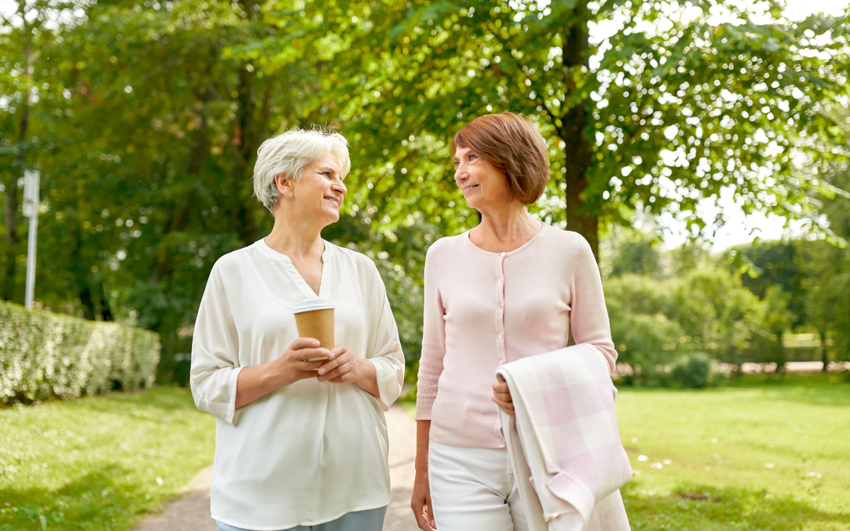 Senior women walking together outside