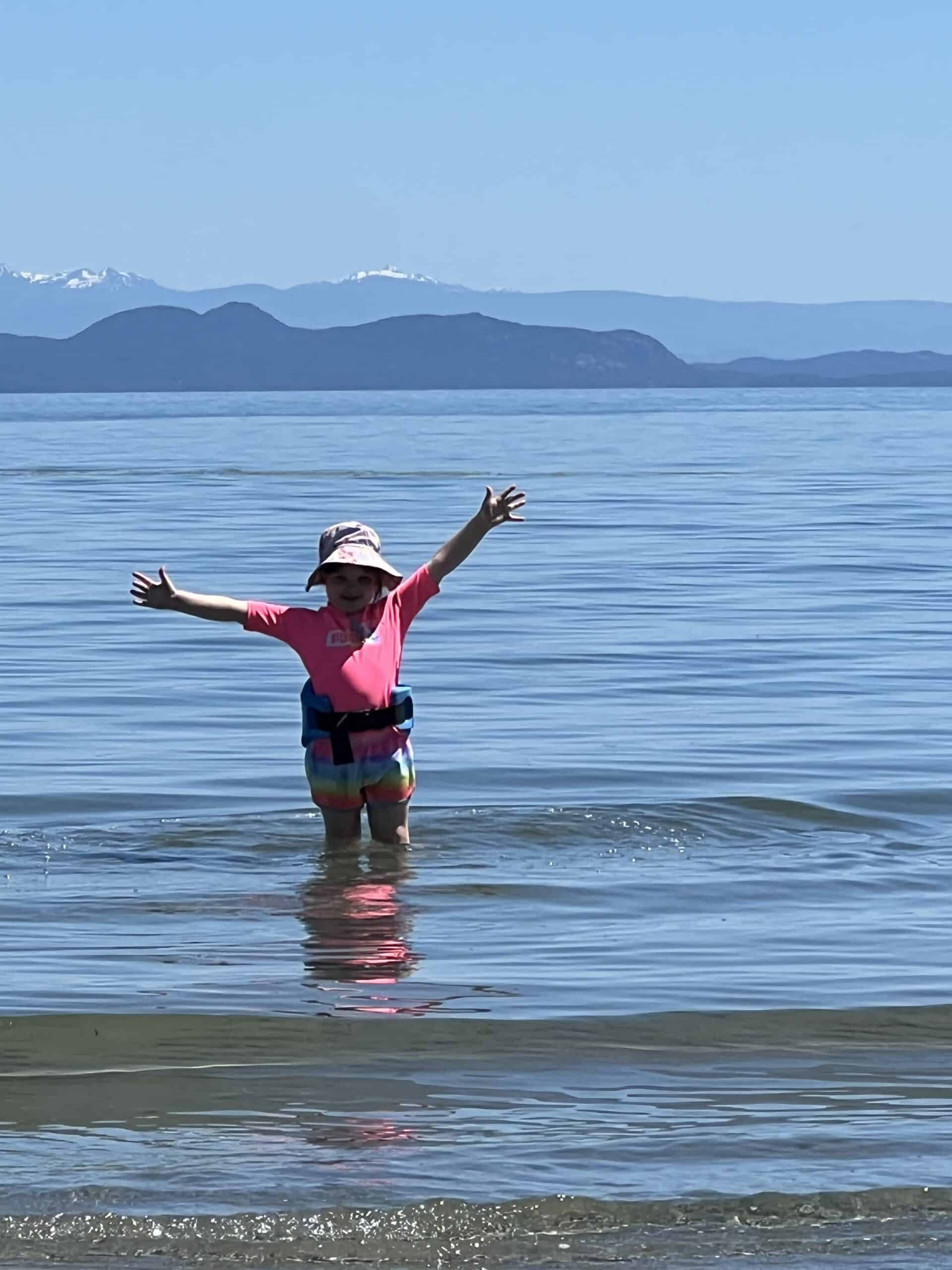 “Coastal view on Vancouver Island with driftwood and ocean, capturing the peaceful rhythm of island life.”