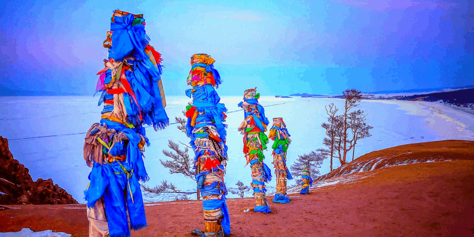 Shamanistic poles on a winter landscape