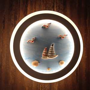 Circular sea themed wall light with backlighting at ecolight