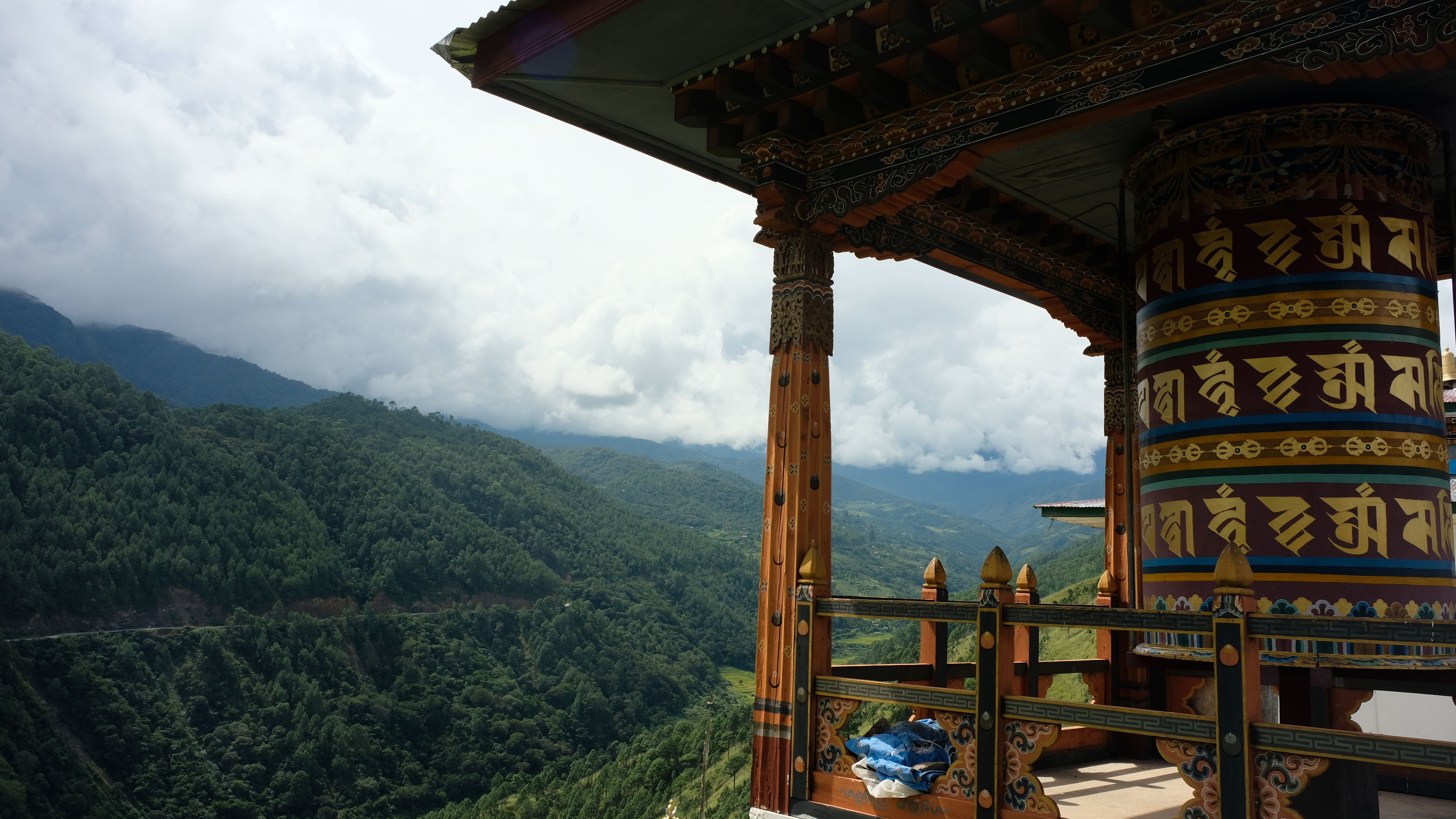 Prayer wheel with mountains in the background