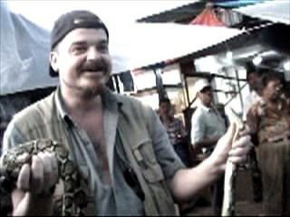 Holding a python on a break in Indonesia