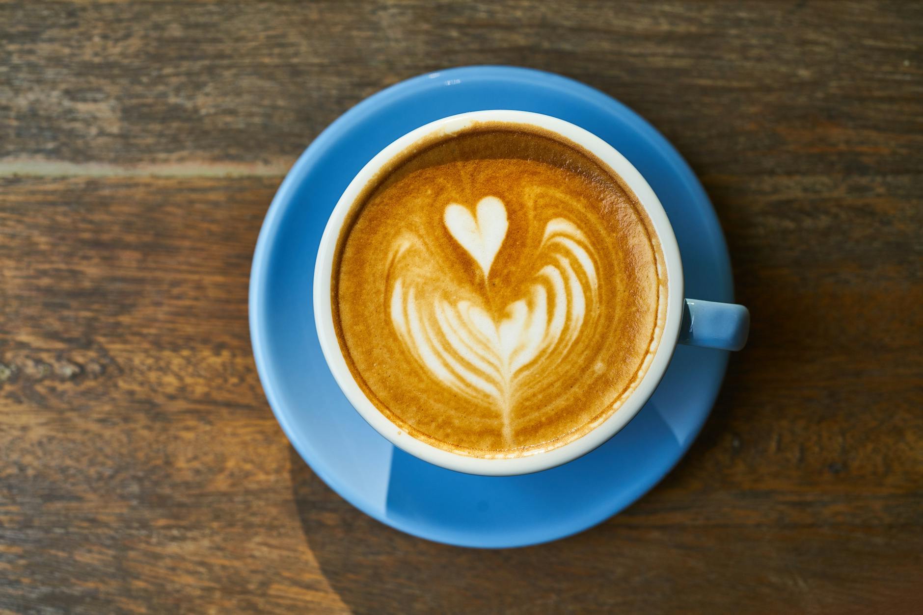 cappuccino on blue ceramic saucer