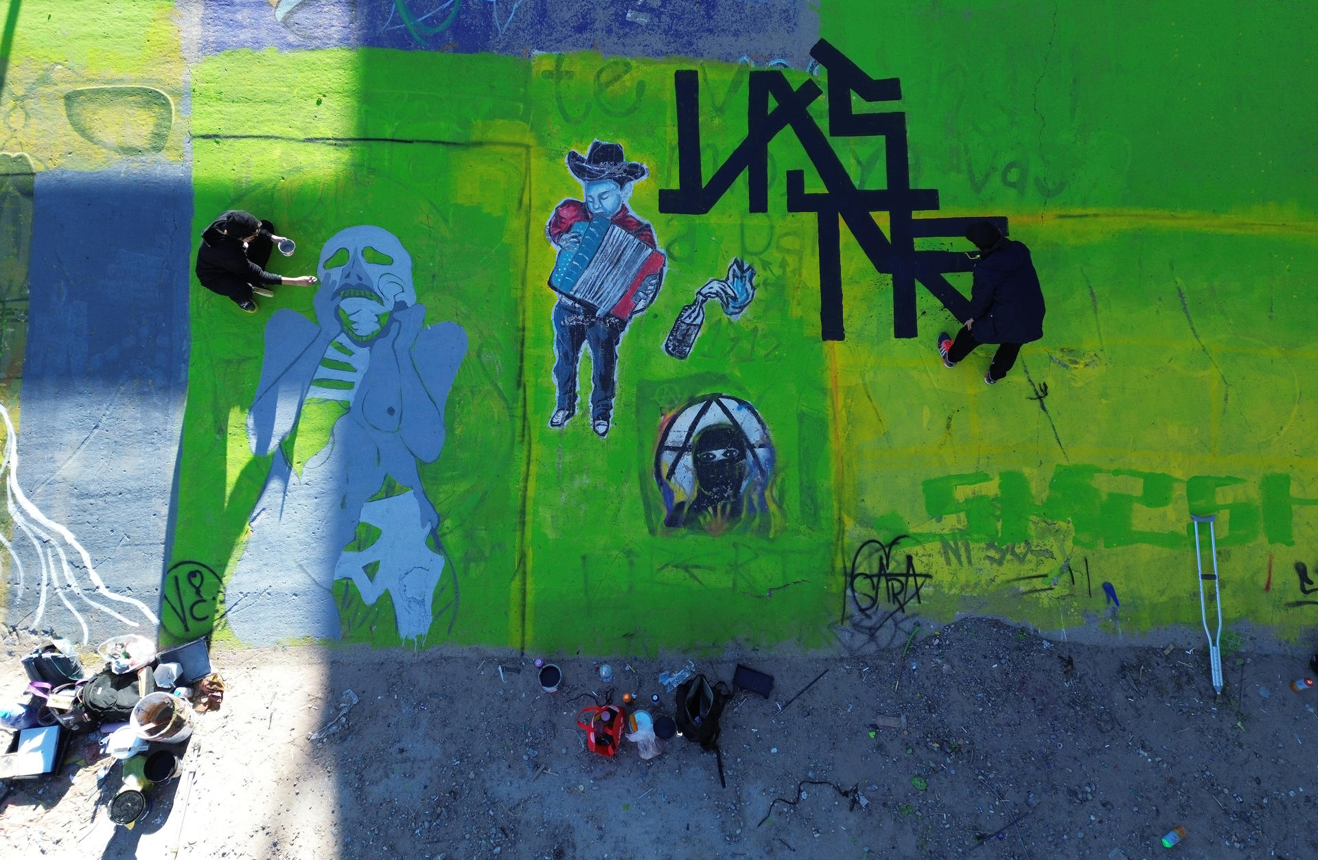 Activists protest violence against migrants with 70 murals on US