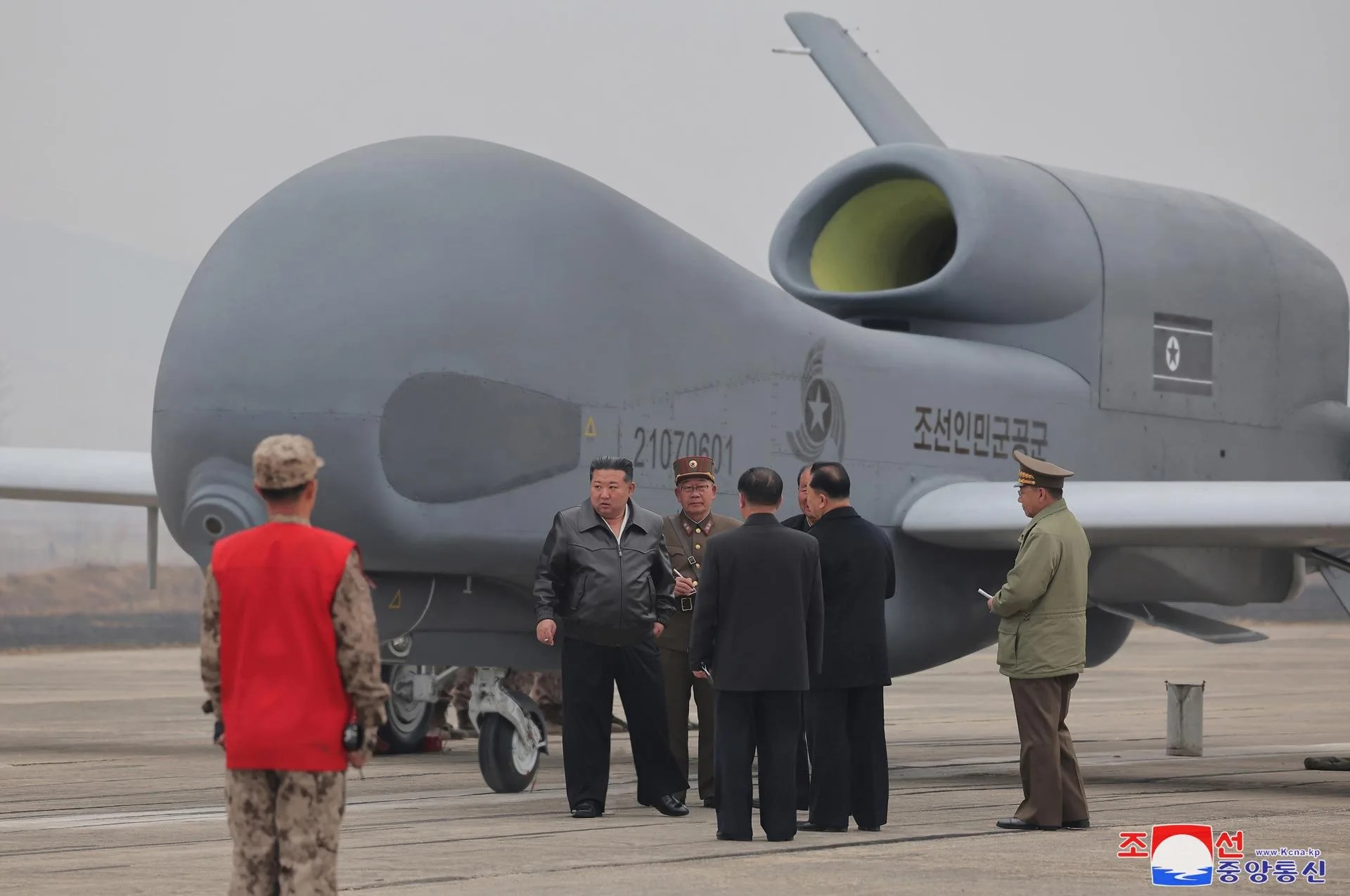 An undated photo released by the official North Korean Central News Agency (KCNA) on 27 March 2025 shows North Korean leader Kim Jong Un (2-L) inspecting what appears to be a large reconnaissance drone at an undisclosed location in North Korea. EFE/EPA/KCNA EDITORIAL USE ONLY