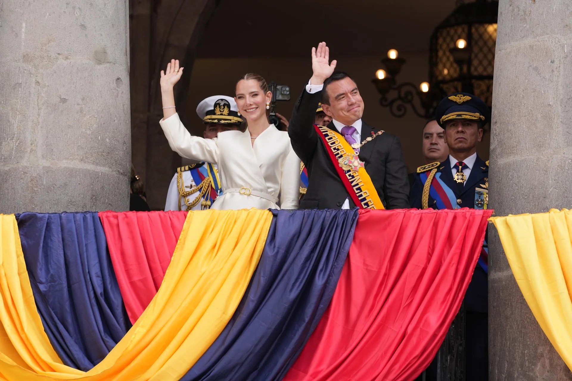 (FILE). Ecuadorian President Daniel Noboa (right) waves with his wife, Lavinia Valbonesi (left), from a balcony at the Carondelet Palace in Quito, Ecuador, after being sworn in as president. May 25, 2025. EFE/ Vicente Costales