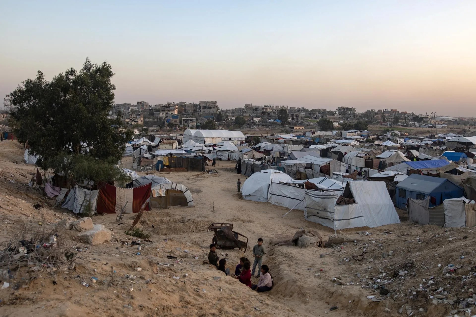 (FILE) - Displaced Palestinian families reside at an informal camp in Khan Younis, southern Gaza Strip, Nov. 18, 2025. EFE/EPA/HAITHAM IMAD