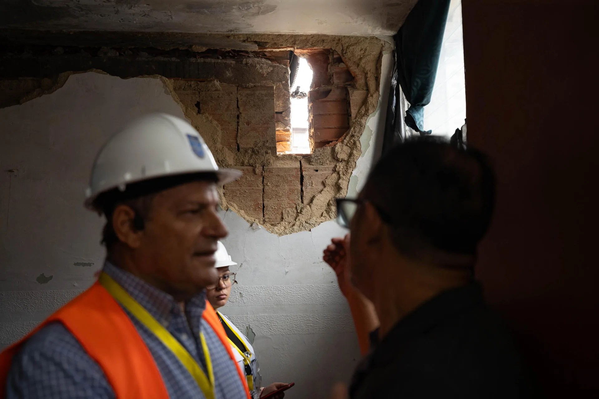 Photograph from July 14, 2026, showing engineers in front of a destroyed wall in a building affected by the two earthquakes in Caracas, Venezuela. EFE/ Ronald Peña R