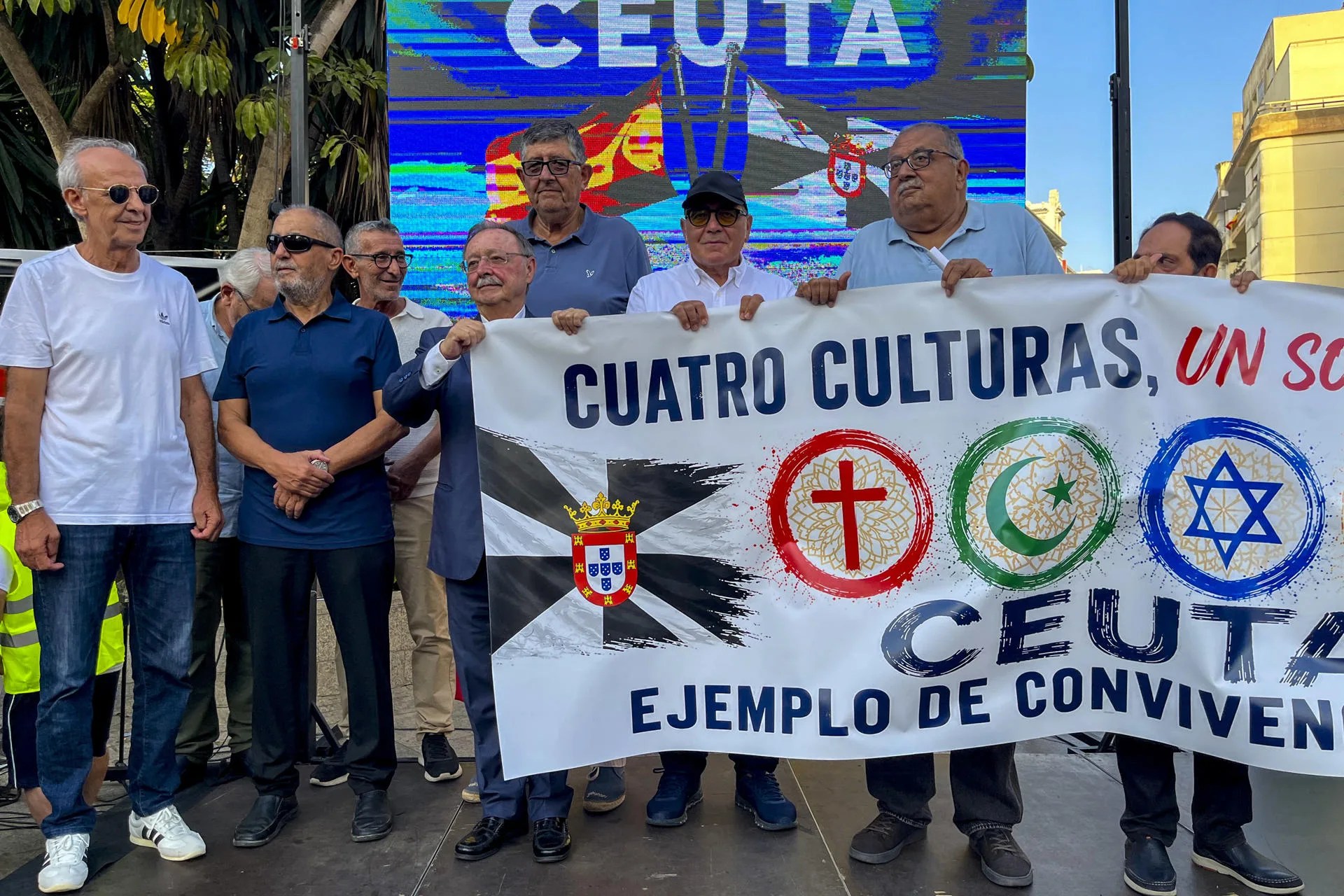 El presidente de Juan Jesús Vivas (4-i), mayor of the Autonomous City of Ceuta, accompanied by representatives of Ceuta’s four religious communities (Christian, Muslim, Hindu, and Jewish), who organized the massive demonstration in Ceuta on Aug. 9, 2026. EFE/Reduan
