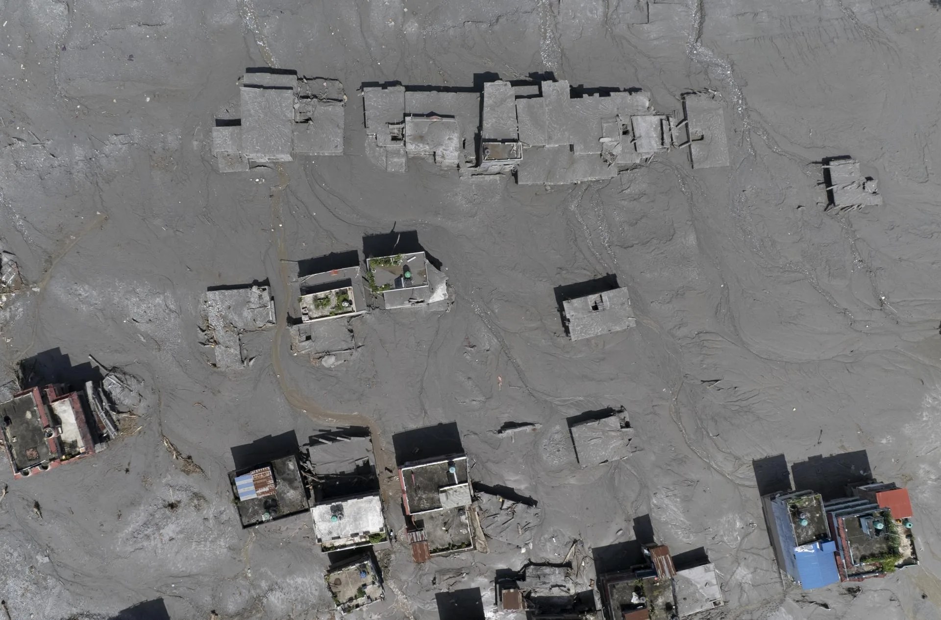 An aerial view of damaged homes in Delight village following a flash flood, in Nuwakot district, Nepal. Aug. 27, 2026. EFE/EPA/NARENDRA SHRESTHA
