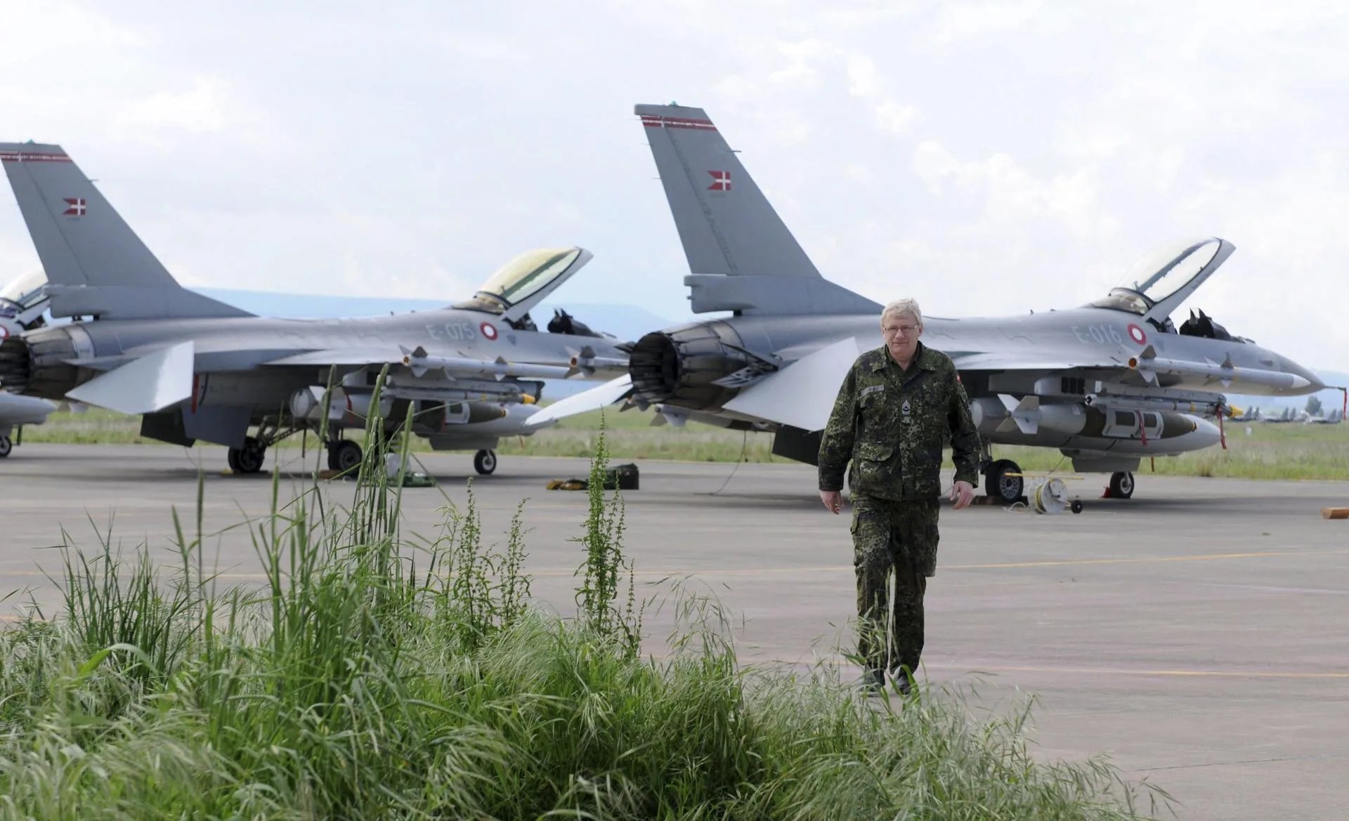 [FILE] A Danish airforce personnel walking on the tarmac next to Danish F-16 aircraft at the Nato airbase in Sigonella, Catania region, Sicily island, Italy, 20 March 2011. EPA/ORIETTA SCARDINO