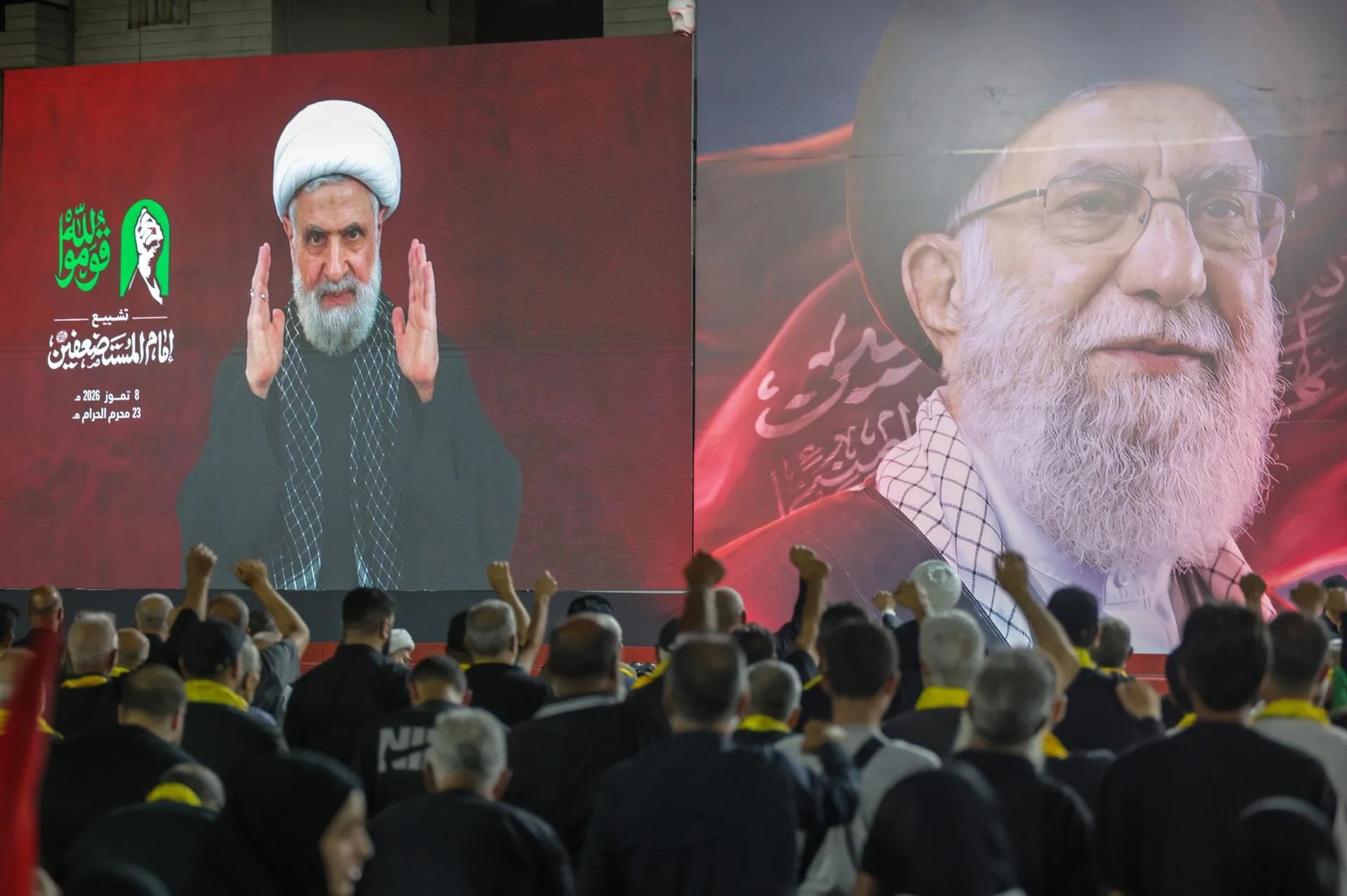 (FILE). Supporters of Hezbollah listen to Secretary-General Naim Qassem as he delivers a televised speech via a large screen during a memorial ceremony for the late Supreme Leader Ali Khamenei in the southern suburbs of Beirut, Lebanon. Jul. 08, 2026. EFE/EPA/WAEL HAMZEH