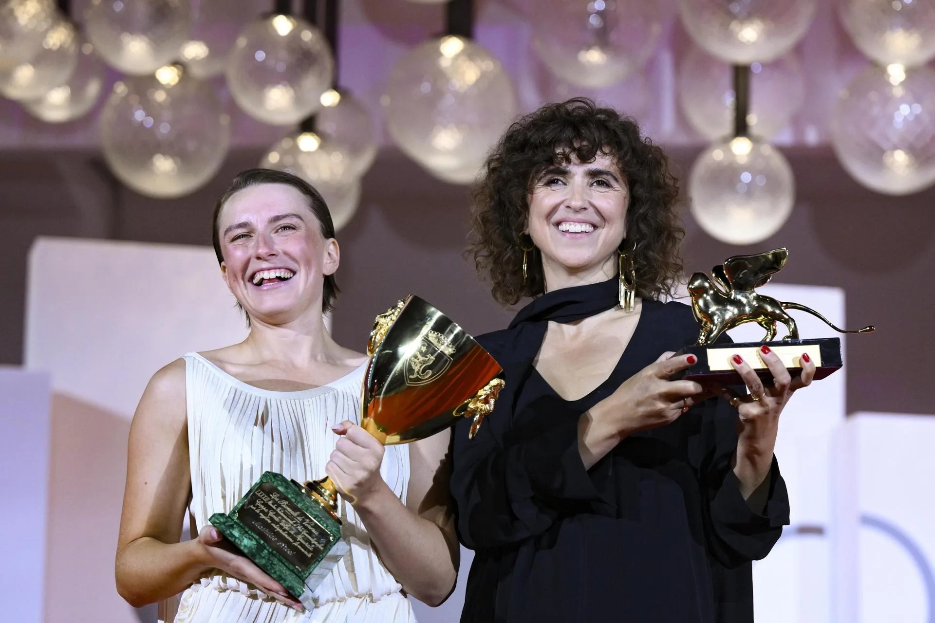 VENICE (Italy), 12/09/2026.- Danish director May el-Toukhy (R) holds the Golden Lion award and Danish actor Mathilde Arcel holds the Coppa Volpi for Best Actress for their film 'Kvinde Ukendt (Woman Unknown)' during the closing ceremony of the 83rd annual Venice International Film Festival in Venice, Italy, 12 September 2026. EFE/EPA/ETTORE FERRARI