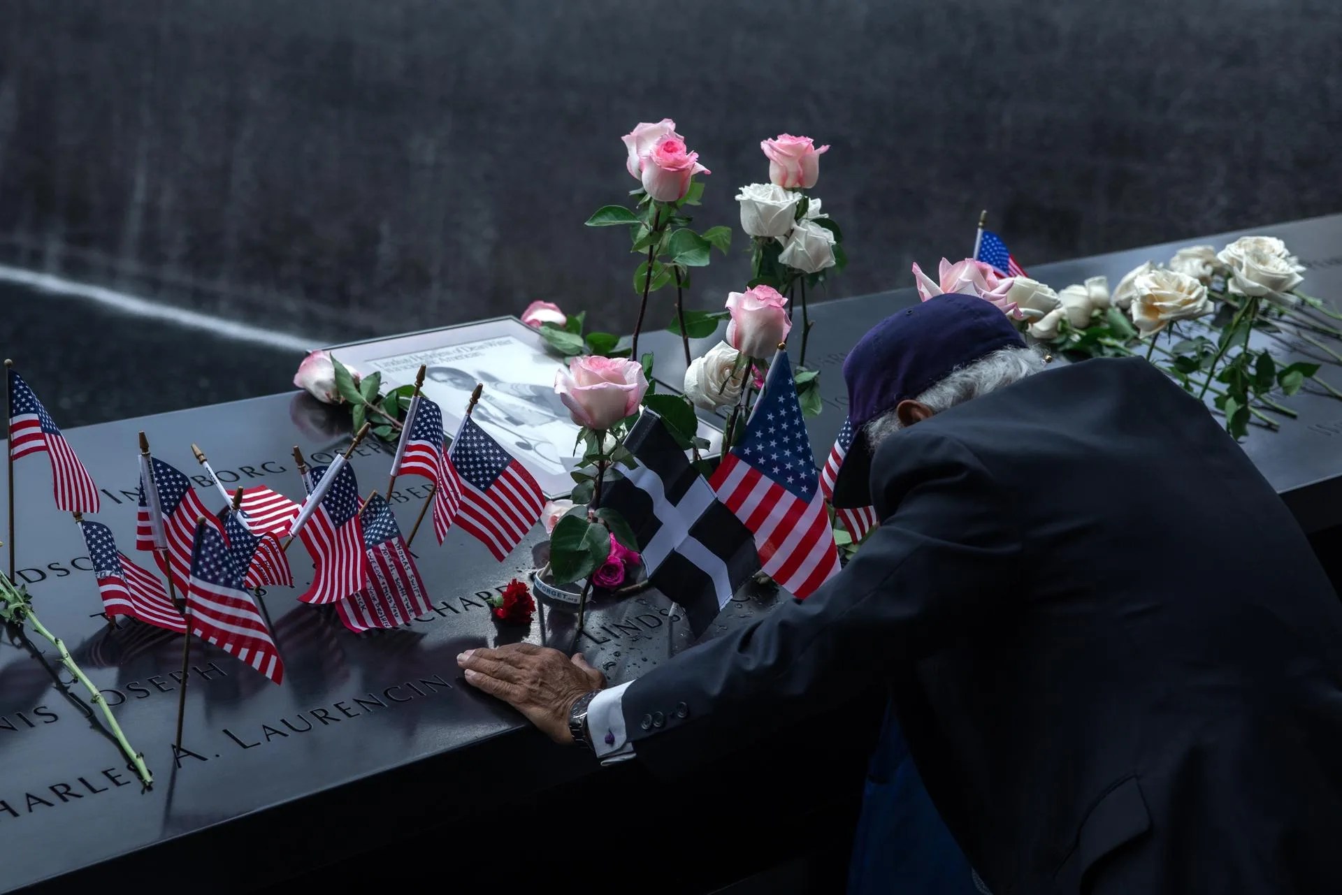 A man mourns at a reflecting pool inscribed with names of the victims during memorial observances on the 25th anniversary of the 9/11 terror attacks, at the site of the World Trade Center in New York, New York, US, 11 September 2026. EFE/EPA/OLGA FEDOROVA
