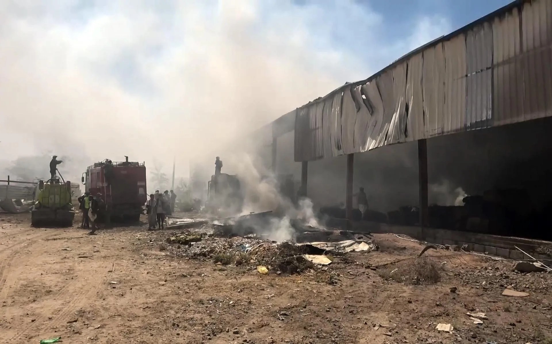 (FILE). A handout screen grab taken from a video made available by the Houthis-run al-Masirah TV on Oct. 04, 2026 shows firefighters extinguish the fire after an alleged Saudi airstrike targeted a factory in Sana'a, Yemen. Oct. 04, 2026. EFE-EPA/HOUTHI-RUN AL-MASIRAH TV HANDOUT HANDOUT EDITORIAL USE ONLY/NO SALES