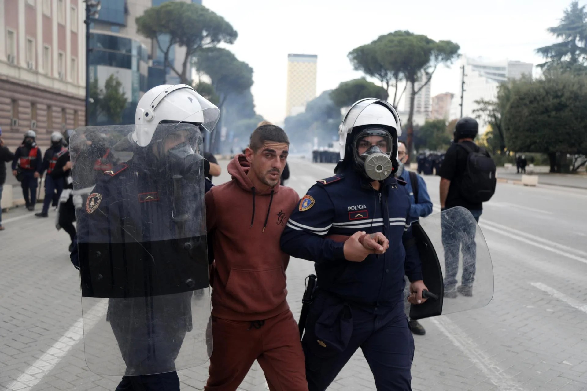 Riot police officers detain a protester during a student demonstration in Tirana, Albania. Oct. 15, 2026. EFE/EPA/MALTON DIBRA