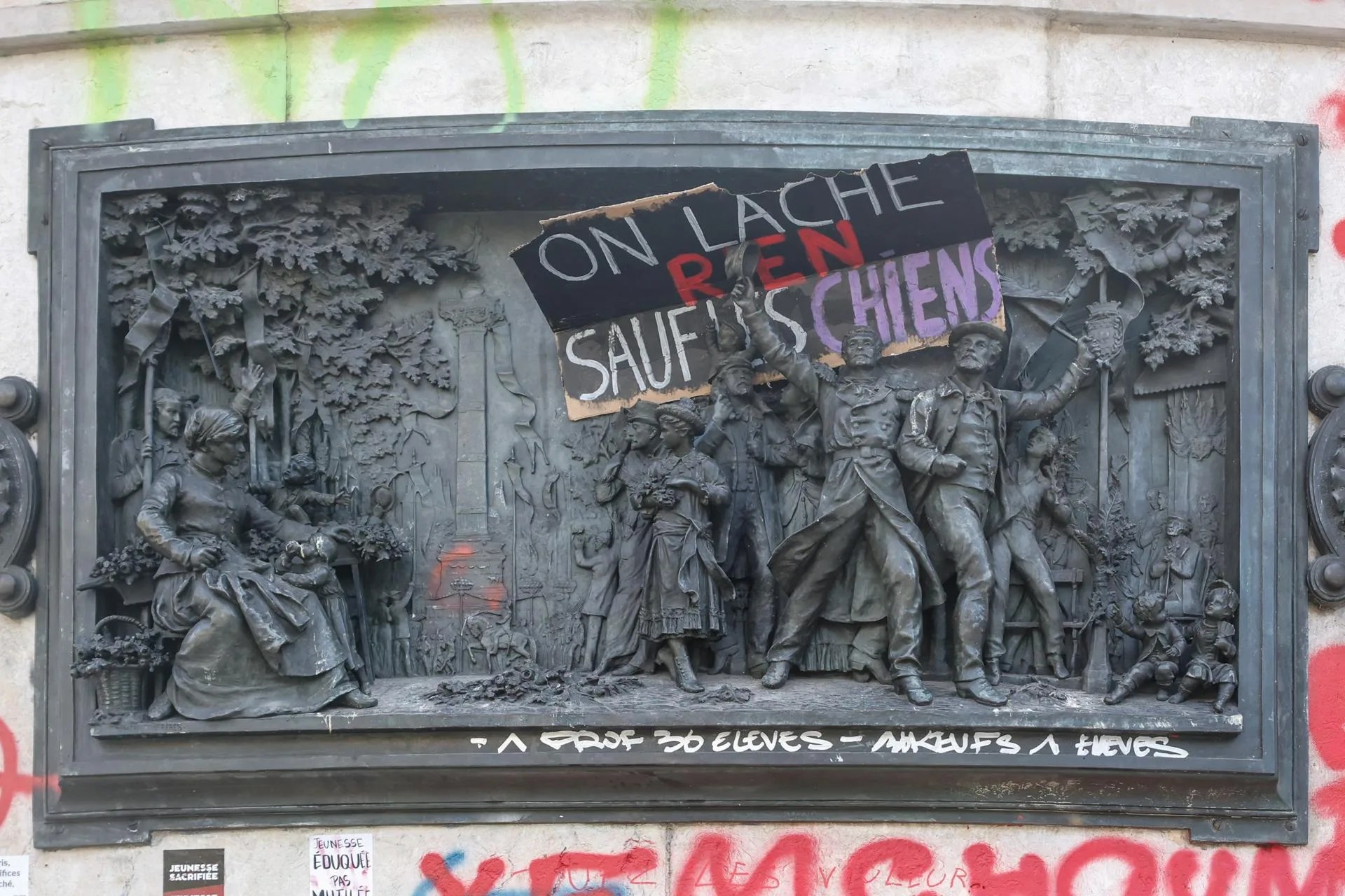 Graffiti left by protesters on the Statue de la Republique in the aftermath of clashes between riot police and demonstrators during nationwide protests against the high cost of living in the country, in Paris, France, 18 October 2026. EFE-EPA/MOHAMMED BADRA
